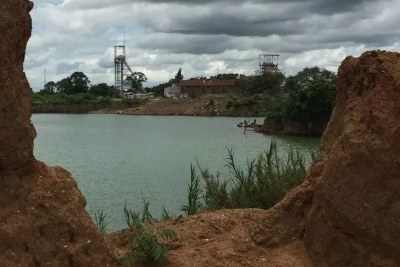 View of a former mine pit, now flooded, at the old mine site in Kabwe. In the foreground is an area where small-scale miners still work today (file photo).
