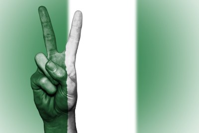 Nigerian peace hand sign.