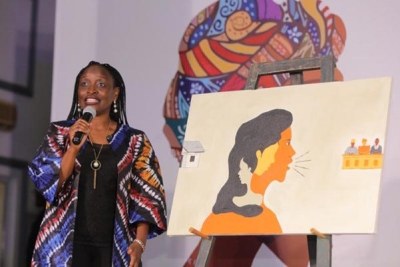 Dorcas Akila, Programme Manager, The Challenge Initiative (TCI) during the “Voice it Up” session. Art work: Voice of my inner woman by Mangai Joel Dawang.