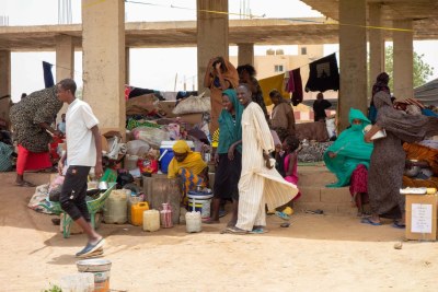 Internally displaced persons seeking refuge in an incomplete structure in Kassala after fleeing conflict in Sinnar and Sinjah.
